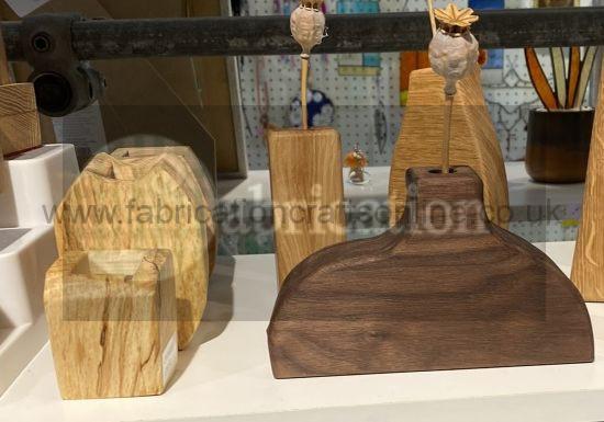 hand made wooden vase suitable for displaying a single or small number of budsflowers
some are suitable for dried flowers only others have a plastic tube which can be filled with water to preserve the flower
various sizes sanded to a fine finish and finished with burnishing oil