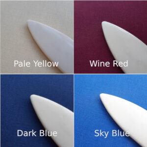 a composite image showing 4 colours of bookcloth, pale yellow, wine red, dark blue, and sky blue