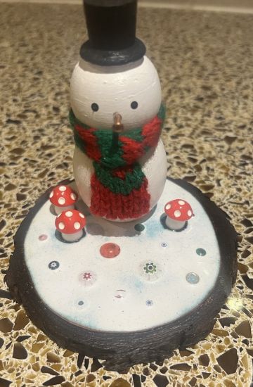 single painted wooden mushroom on an enamelled copper base 