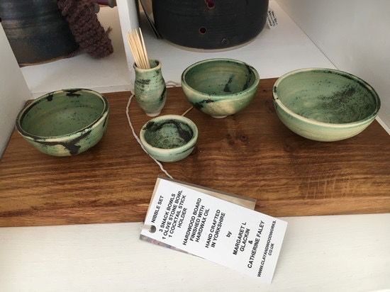 hand thrown ceramic entertainment set comprising large medium small bowl and a cocktail stick holder these sit on a hard wood board which is finished with coats of food safe oil
a lovely way to serve nibbles etc to your guests