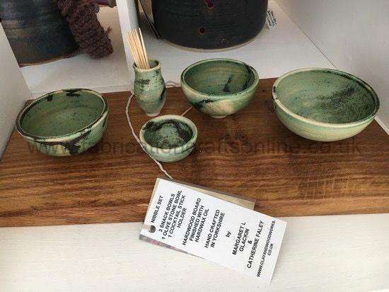 Nibble Set nibble set hand thrown ceramic entertainment set comprising large medium small bowl and a cocktail stick holder these sit on a hard wood board which is finished with coats of food safe oil
a lovely way to serve nibbles etc to your guests