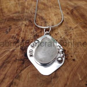 Sea glass necklace with decorative surround