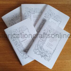 Five white pamphlet notebooks each with the same ornamental frame on but with different quotes from Shakespeare's first folio.