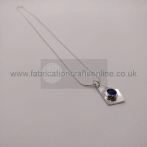 Sea glass bezel set necklace with silver surround