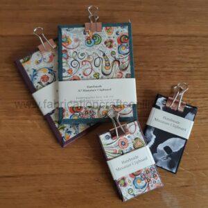 A selection of miniature clipboards of various designs.