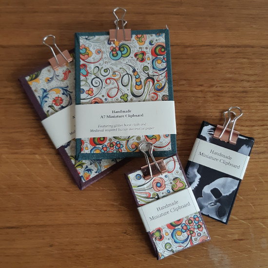 A selection of miniature clipboards of various designs.