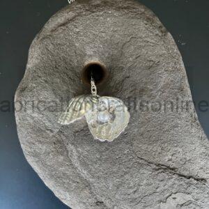 hand cast pewter shells with a real pearl hidden in the centre on an  inch sterling  silver chain 