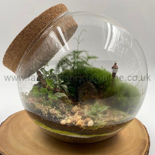 hobbits garden terrarium
not for shipping click and collect available
creative <strong>terrarium</strong> bringing the beauty of the forest to your urban space
this miniature ecosystem is mostly self sustaining you can enjoy this bottled garden for years to come
<ul>
<li>place it in a bright room away from direct sun and heat sources</li>
<li>keep an eye on watering specially in summer months misting only if the soil is dry and there is no condensation on the walls this might be once in weeks or less</li>
<li>remove dead or rotting leaves</li>
<li>keep the glass clean</li>
</ul>
why terrariums
<ul>
<li>extremely easy to care for</li>
<li>not very fussy with lighting conditions</li>
<li>take very little space</li>
<li>very hard to kill unlike other houseplants </li>
<li>they dont die when you go on holiday</li>
<li>why they look absolutely gorgeous </li>
</ul>
they make the perfect gift for any occasion whether its a birthday anniversary or just to show your love
go on and make someones day with a very special and unique gift
or why not just treat yourself