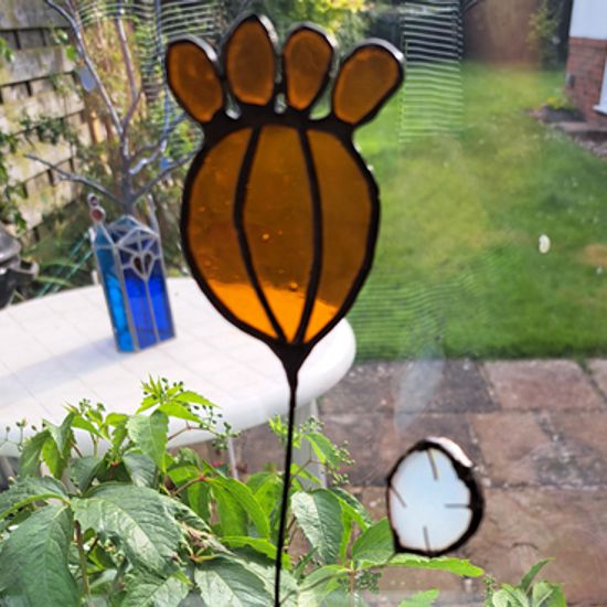 stained glass flower on stem 