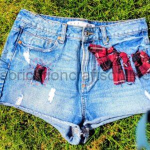 plaid detail in rag rug and visible mending  aiming to be carbon nuetral fashion  hand was only delicate 