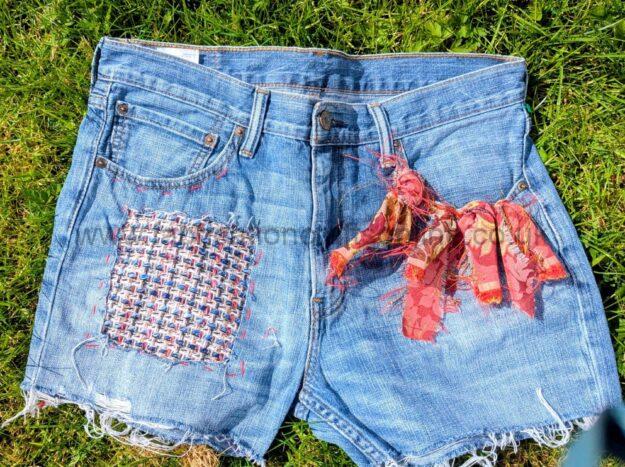 resued denim repurposed  ancient craftb of rag rugging detail to pocked with mathing bsashiko style visible mending 