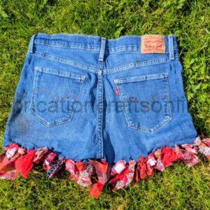 funky upcycled rescued denim levi skirt short with tassle trim