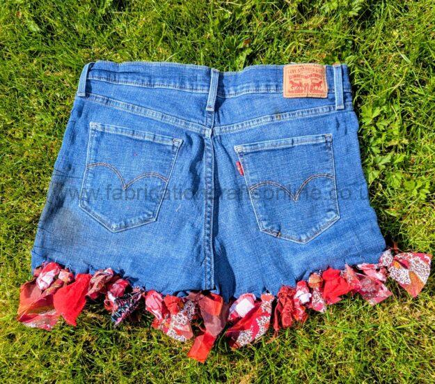 plaid detail in rag rug and visible mending  aiming to be carbon nuetral fashion  hand was only delicate 