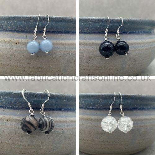 sterling silver rings with recycled silver details slim round bands with either a ball or disc shaped embellishment variety of sizes available 