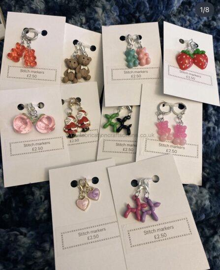 stitch markers a handmade crochet worry worm which was made using a variety of different yarns