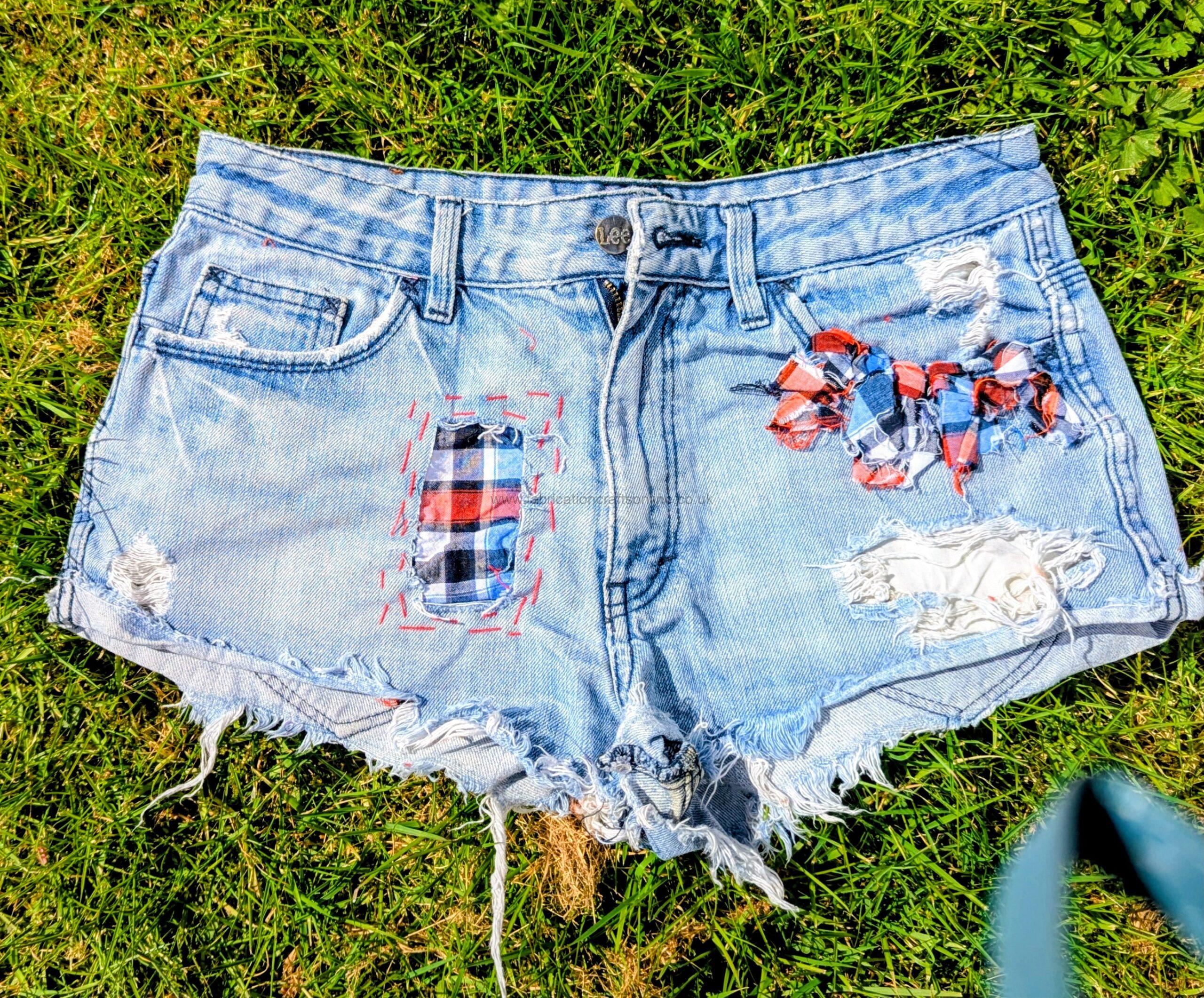 plaid detail in rag rug and visible mending  aiming to be carbon nuetral fashion  hand was only delicate 