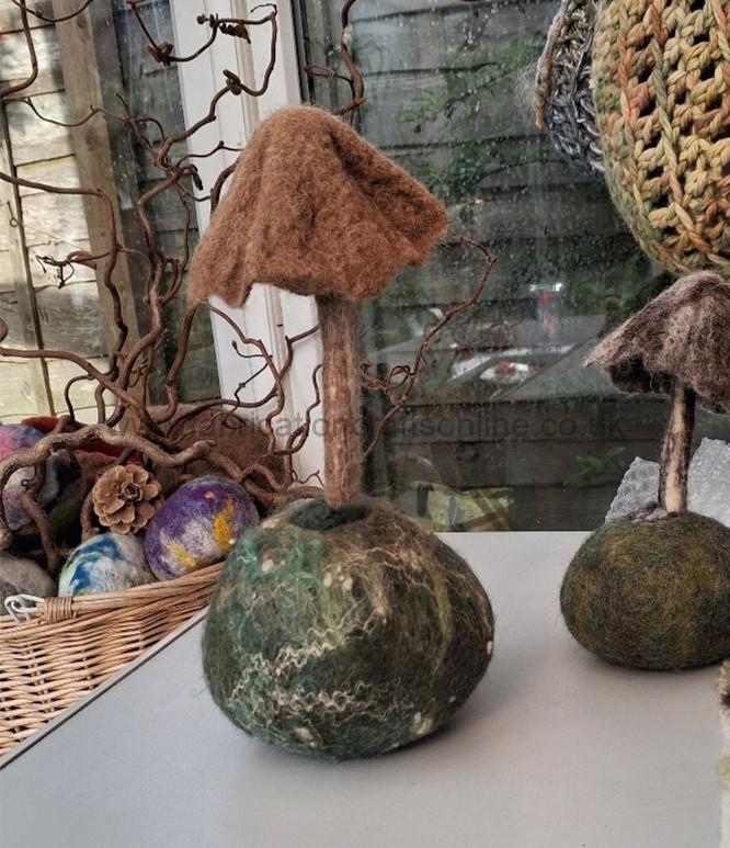 wet felted mushroom on its own pod 