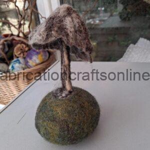 wet felted mushroom on its own pod 