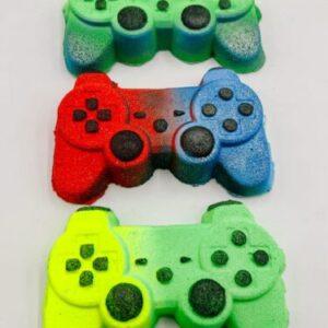 Three neon-colored foam game controllers stacked vertically on a white background (green, red/blue, and yellow).
