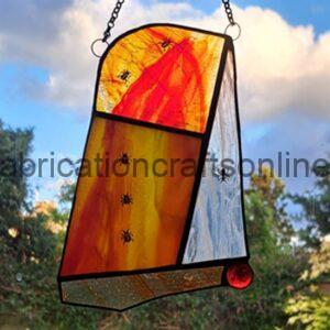 stained glass panel suitable for hanging in a window or on a light coloured wall 