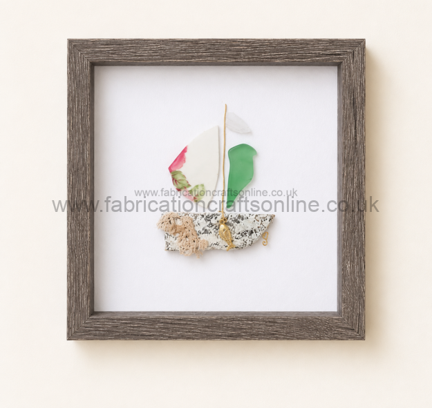 handmade sea glass and vintage china sailing boat featuring an ornate vintage cutlery blade hull framed in a  ×  cm black shadow box a unique coastal inspired piece for any home