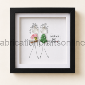 Framed minimalist drawing of two best friends, stick-figure women with fabric bodies and curly hair, standing side by side with 'besties for life' text nearby.