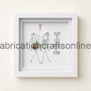 Framed artwork showing two stick‑figure sisters in fabric dresses with the caption 'Always my sister forever my friend'