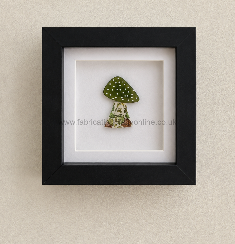 a charming handcrafted york ghost made from genuine sea glass holding a traditional lantern while standing on hand drawn york cobbles beautifully presented in a  x  cm shadow box frame