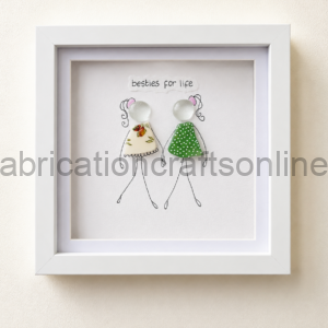 Framed illustration of two stick-figure girls in fabric dresses with the caption 'besties for life' above them (handmade art).