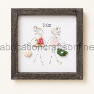 Framed illustration of two stick-figure sisters labeled 'Sisters'; each wears a fabric dress (floral and pink polka) and holds a shell and a green bag as accessories.