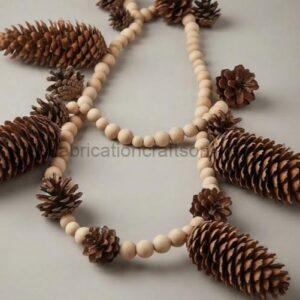 Cream bead necklace with pinecone embellishments laid on a light surface
