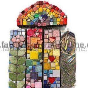 Colorful mosaic cabinet made of small square tiles and fabric swatches in arch shape.
