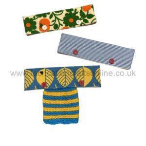 colourful fabric button fastened pouches holding knitting sample