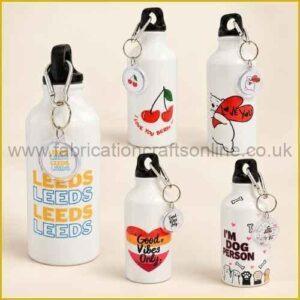White water bottles with themed designs and matching keyrings