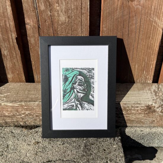 breathing through a framed art print a framed a reproduction of unspoken an expressive portrait exploring hidden emotions vulnerability and the feelings we struggle to express black and white contrasts with subtle golden accents create a striking intimate composition
