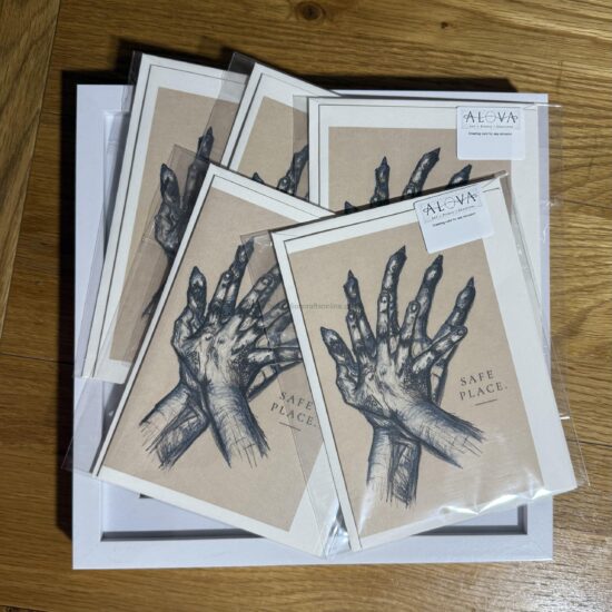 safe place art greeting card a meaningful a greeting card featuring an expressive illustration of hands gently holding one another with the words you are held this design offers a quiet reminder of comfort connection and emotional support