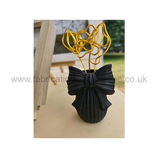 minimalist wire flowers protective horseshoe with hand sculpted bartmann jug style face and other treasures 🧚 ✨